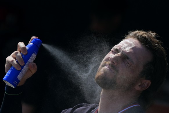 Cleveland Guardians&#039; Daniel Schneemann applies sunscreen prior to a spring training baseball game against the Los Angeles Dodgers, Tuesday, March 11, 2025, in Phoenix. (AP Photo/Ross D. Franklin) ...