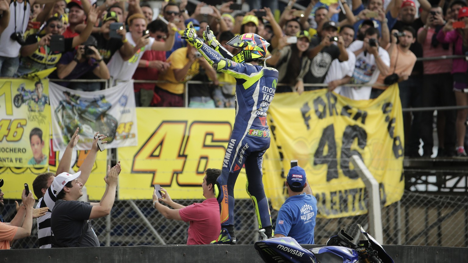 Valentino Rossi of Italy acknowledges the fans after finishing second in the Motorcycle Grand Prix at the Termas de Rio Hondo circuit in Argentina, Sunday, April 3, 2016. (AP Photo/Victor R. Caivano)