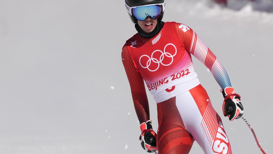 Michelle Gisin, of Switzerland reacts after finishing women&#039;s downhill training at the 2022 Winter Olympics, Monday, Feb. 14, 2022, in the Yanqing district of Beijing. (AP Photo/Luca Bruno)