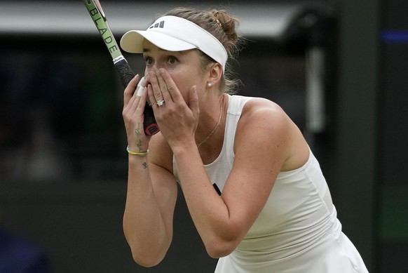 Ukraine&#039;s Elina Svitolina celebrates after beating Poland&#039;s Iga Swiatek to win their women&#039;s singles match on day nine of the Wimbledon tennis championships in London, Tuesday, July 11, ...