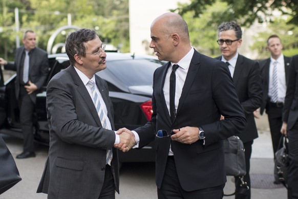 Alain Berset, right, Member of the Swiss Federal Council, shakes hands to Michael Hengartner, Director of the University of Zurich, left, during the Opening Ceremony of the european biennale of contem ...
