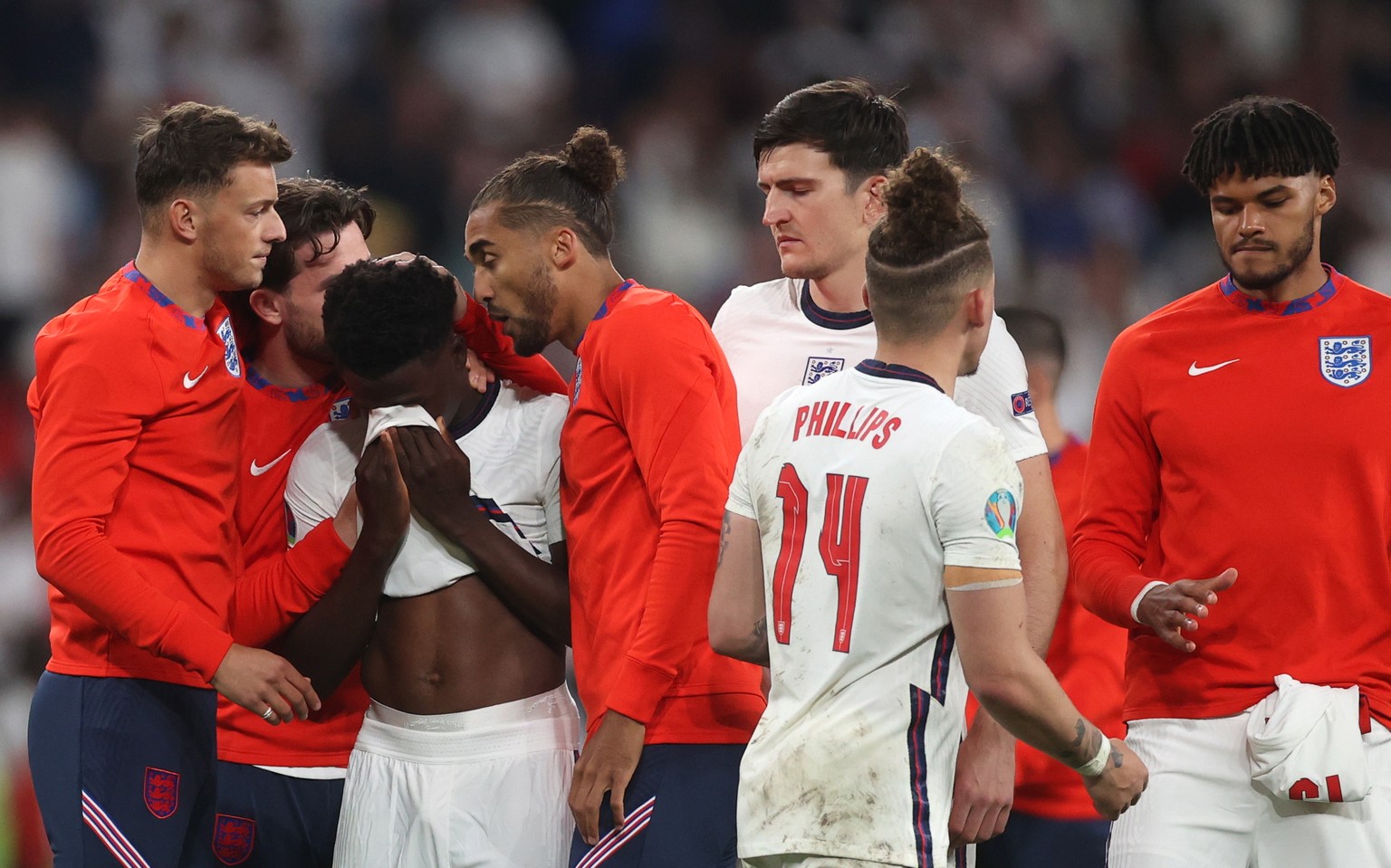 epa09338872 Bukayo Saka (C) of England reacts after failing to score during the penalty shoot-out of the UEFA EURO 2020 final between Italy and England in London, Britain, 11 July 2021. EPA/Carl Recin ...