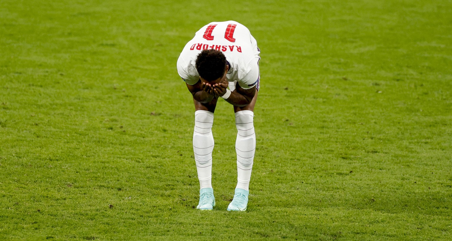 England&#039;s Marcus Rashford reacts after missing his shot during a penalty shootout at the Euro 2020 soccer championship final between England and Italy at Wembley stadium in London, Sunday, July 1 ...