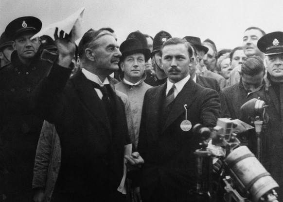 British Premier Neville Chamberlain, who left Munich by air after his successful peace saving effort in conjunction with the French, German and Italian heads of state, saw Hitler, Sept. 30, 1938 and t ...