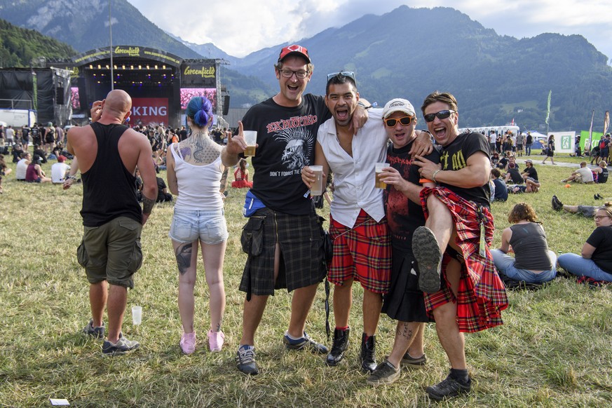 epa06791967 Festival goers with kilts take a pose during the concert of the English metal band Asking Alexandria at the Greenfield Openair Festival in Interlaken, Switzerland, 07 June 2018. EPA/ANTHON ...