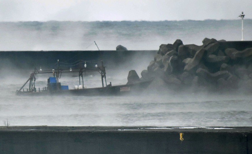 A wooden boat is moored at a nearby marina, in Yurihonjo, Akita prefecture, northern Japan, Friday, Nov. 24, 2017. Japanese police are investigating eight men found on Japan&#039;s northern coast who  ...