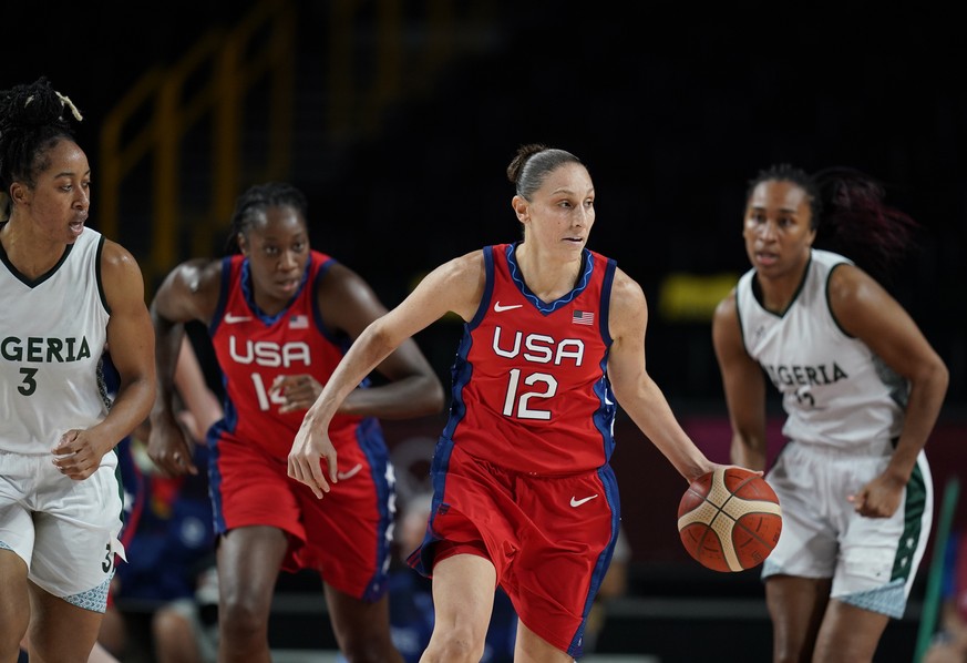 United States&#039; Diana Taurasi (12) drives up the court during women&#039;s basketball preliminary round game at the 2020 Summer Olympics, Tuesday, July 27, 2021, in Saitama, Japan. (AP Photo/Charl ...