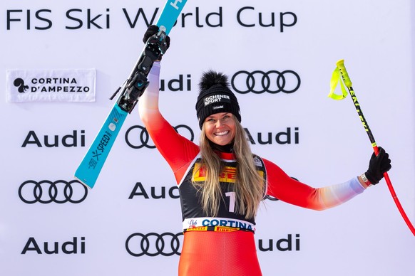 epa11836091 Third placed Corinne Suter of Switzerland celebrates on the podium after the Women's SuperG race at the FIS Alpine Skiing World Cup in Cortina d'Ampezzo, Italy, 19 January 2025.  ...
