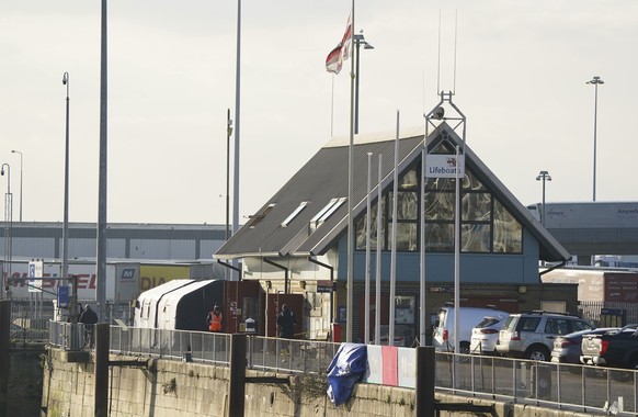 Forensic tents set up at the RNLI station in Dover harbor on Wednesday December.  14, 2022, after a major search and rescue operation launched in the Channel off the coast of Dungeness, in Kent, following…