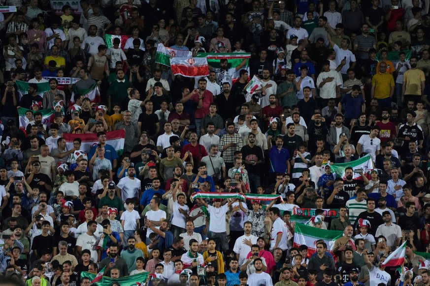 Iranian fans cheer prior to start of Iran and North Korea soccer match during their Asian group A qualifier for 2026 World Cup, at Azadi Stadium in Tehran, Iran, Tuesday, June 10, 2025. (AP Photo/Vahi ...
