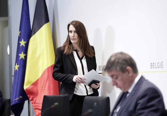 epa08327304 Belgian prime minister Sophie Wilmes (L) and Belgian regional Flemish prime minister Jan Jambon (R) attend a press conference following a National Security Council meeting on coronavirus i ...