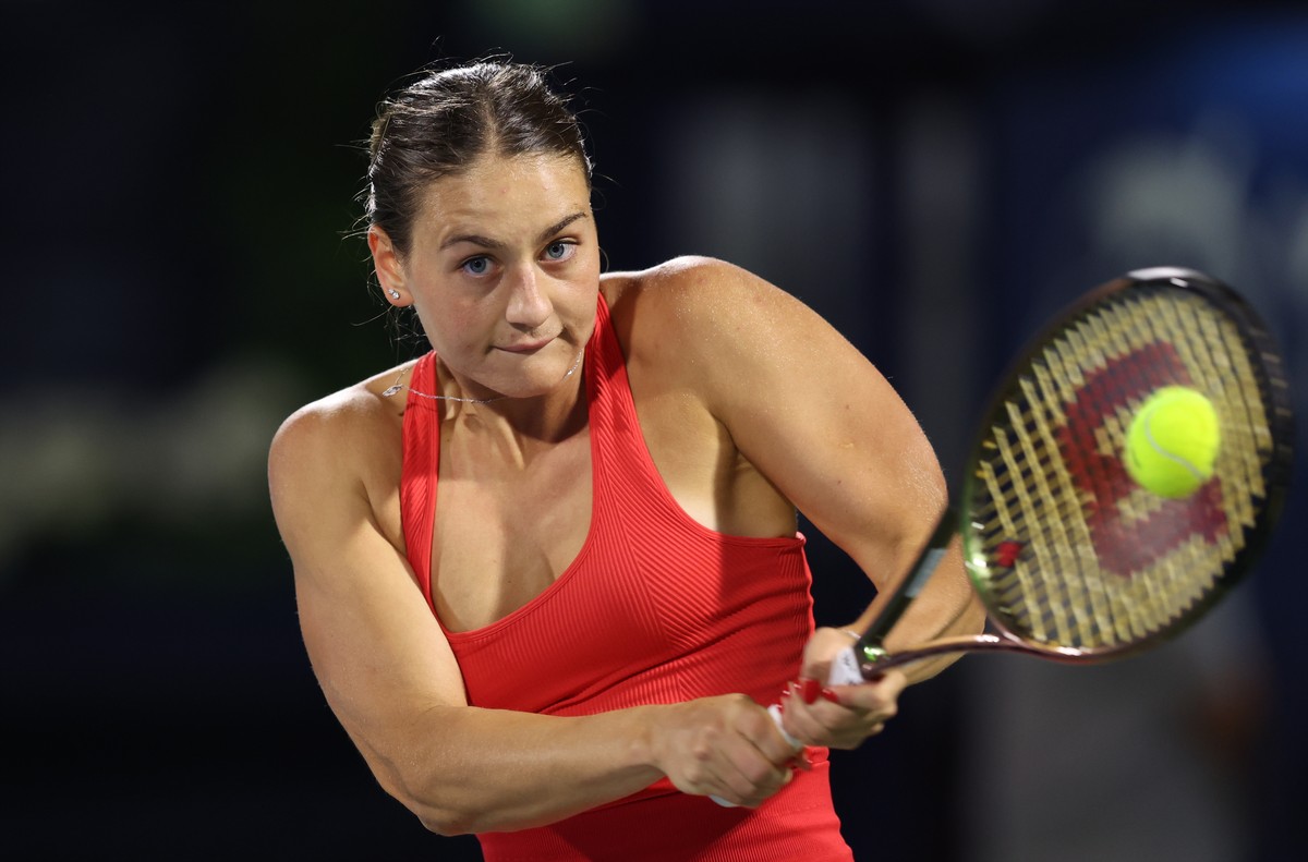epa10478081 Marta Kostyuk of Ukraine in action against Ipek Oz of Turkey during their first round match at the Dubai Duty Free Tennis WTA Championships 2023 in Dubai, United Arab Emirates, 19 February ...