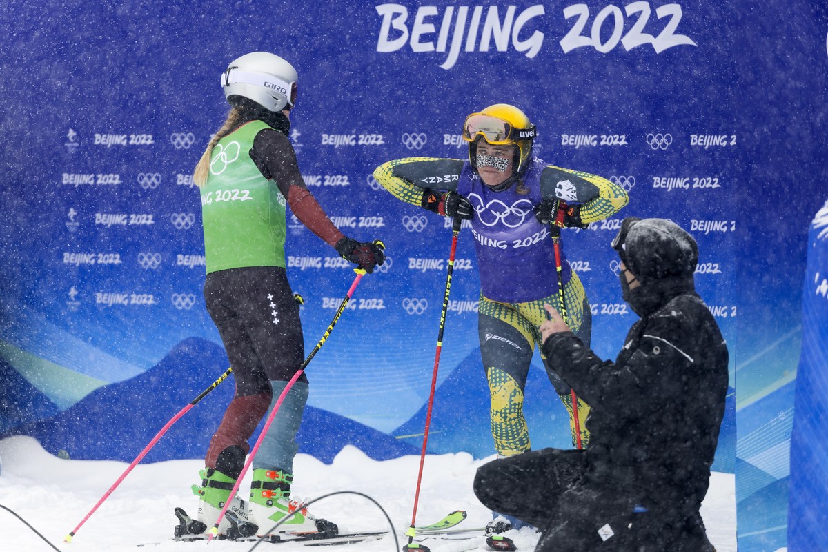 Fanny Smith of Switzerland, left, and Germany's Daniela Maier, right, after the big final run at the women's ski freestyle cross competition at the 2022 Winter Olympics in Zhangjiakou, China ...