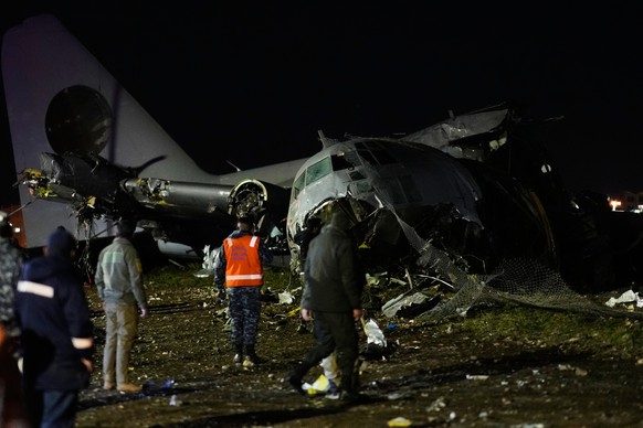 People walk on the scene where a plane crashed on a highway in El Alto, Bolivia, Friday, Feb. 27, 2026. (AP Photo/Juan Karita)
Bolivia Plane Crash