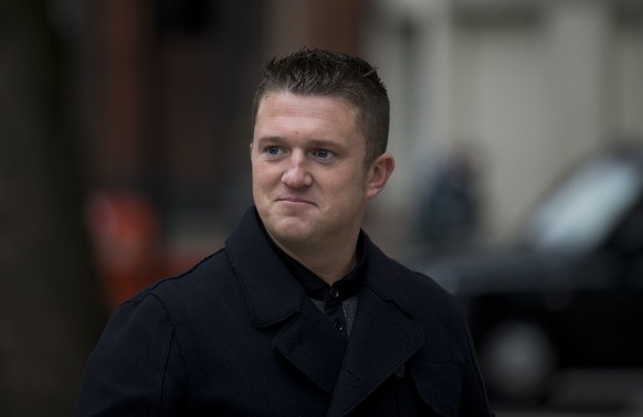 FILE - Tommy Robinson, the former leader of the far-right EDL &quot;English Defence League&quot; group arrives for an appearance at Westminster Magistrates Court in London, Oct. 16, 2013. (AP Photo/Ma ...