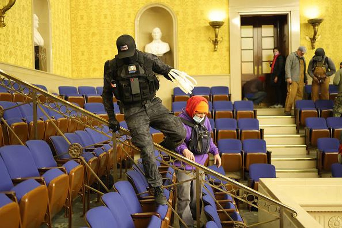 WASHINGTON, DC - JANUARY 06: Protesters enter the Senate Chamber on January 06, 2021 in Washington, DC. Congress held a joint session today to ratify President-elect Joe Biden's 306-232 Electoral ...