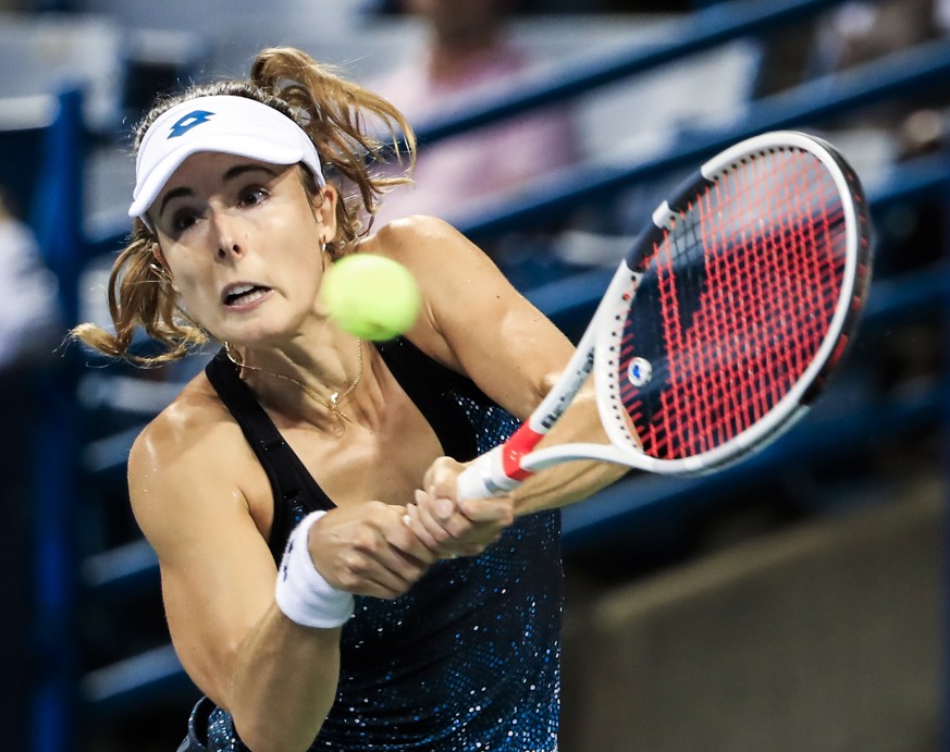 epa06948394 Alize Cornet of France in action against Jelena Ostapenko of Latvia in their first round match of the Western &amp; Southern Open tennis tournament at the Linder Family Tennis Center in Ma ...