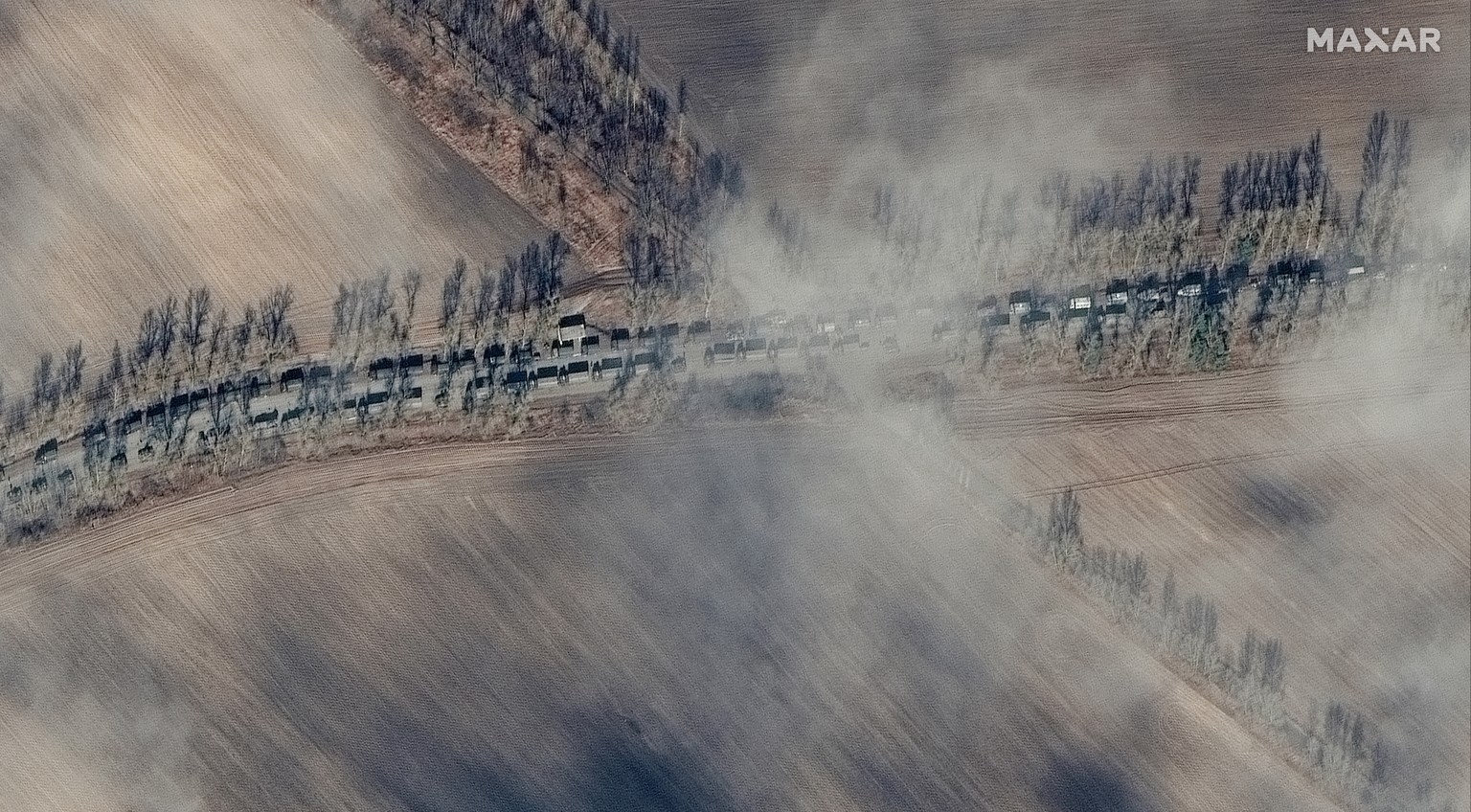 This satellite image image provided by Maxar Technologies shows the near southern end of a large deployment of Russian ground forces in a convoy northeast of Ivankiv, Ukraine, Sunday, Feb. 27, 2022. I ...