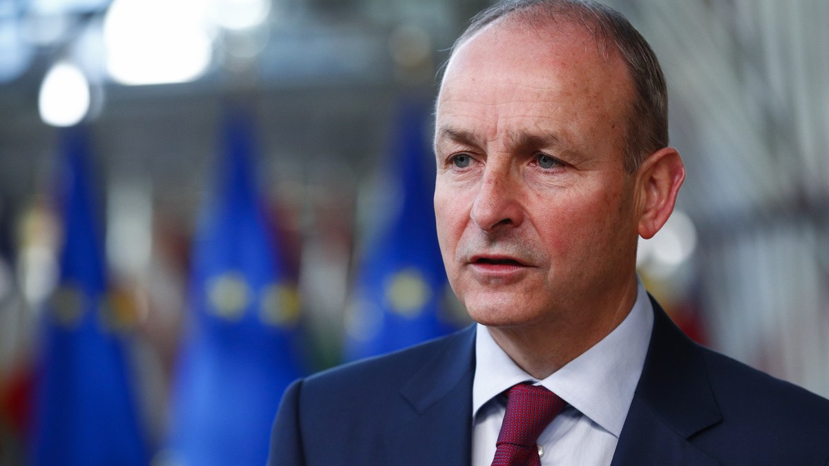 Ireland's Prime Minister Micheal Martin talks to journalists as he arrives for an EU summit in Brussels, Friday, Oct. 22, 2021. European Union leaders conclude a two-day summit on Friday in which ...