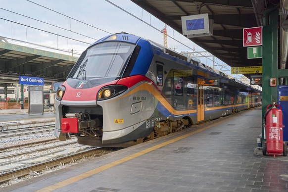 Trenitalia Trains At Bari Central Station An image depicts Trenitalia trains at Bari Central Station, a major railway hub in Southern Italy, on December 5, 2024. The station connects Puglia with the r ...
