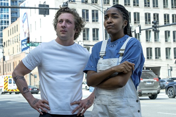 This image released by FX shows Jeremy Allen White as Carmen "Carmy" Berzatto, left, and Ayo Edebiri as Sydney Adamu in a scene from "The bear." (Chuck Hodes/FX via AP)