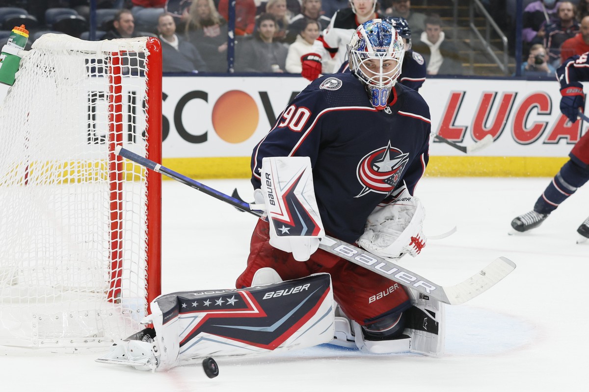 Columbus Blue Jackets' Elvis Merzlikins makes a save against the New Jersey Devils during the third period of an NHL hockey game Tuesday, March 1, 2022, in Columbus, Ohio. (AP Photo/Jay LaPrete)
 ...