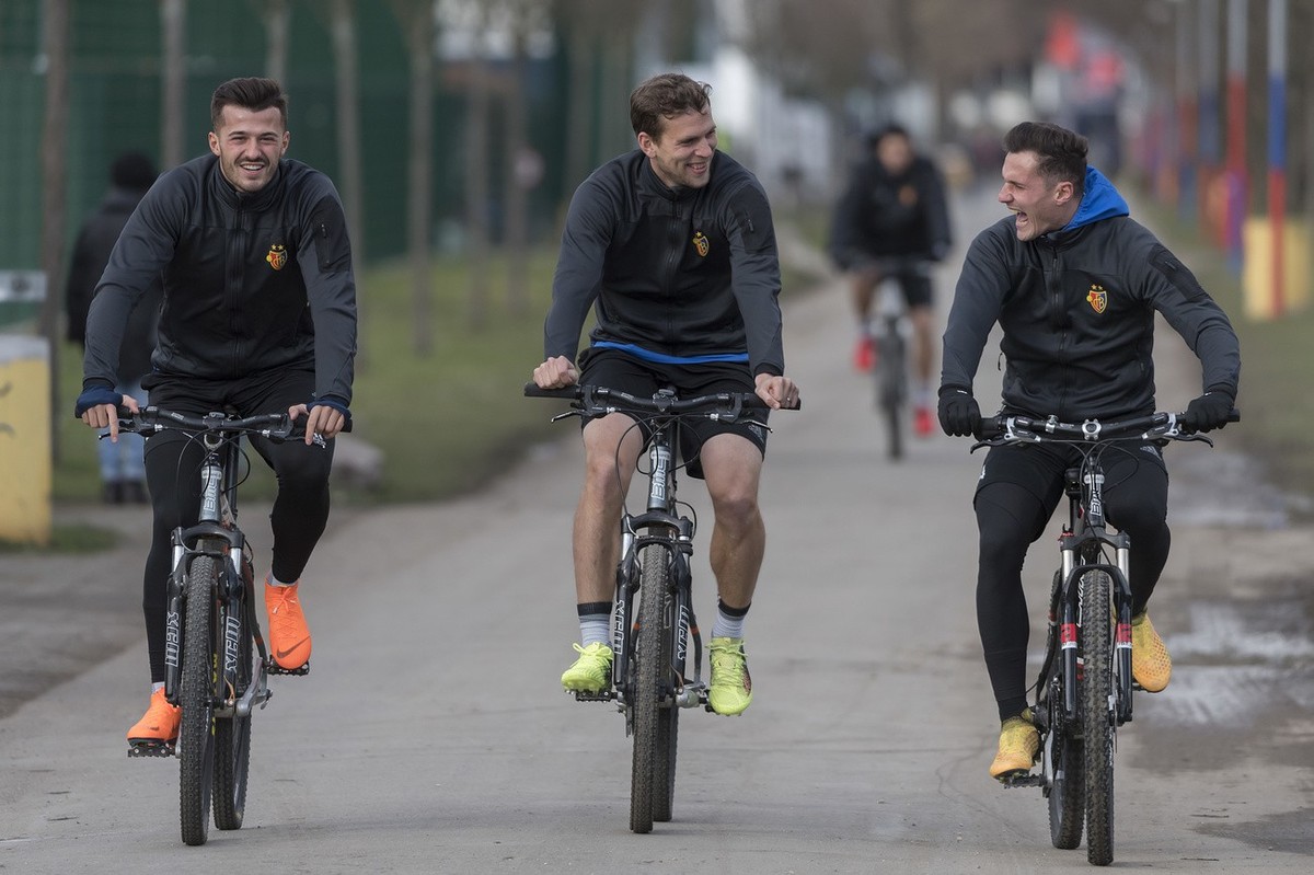 Basel's Albian Ajeti, Fabian Frei and Taulant Xhaka, from left, during a training session the day before the UEFA Champions League round of sixteen first leg soccer match between Switzerland' ...