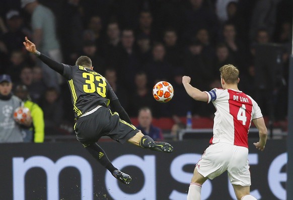 Juventus midfielder Federico Bernardeschi, left, kicks the ball during the Champions League quarterfinal, first leg, soccer match between Ajax and Juventus at the Johan Cruyff ArenA in Amsterdam, Neth ...