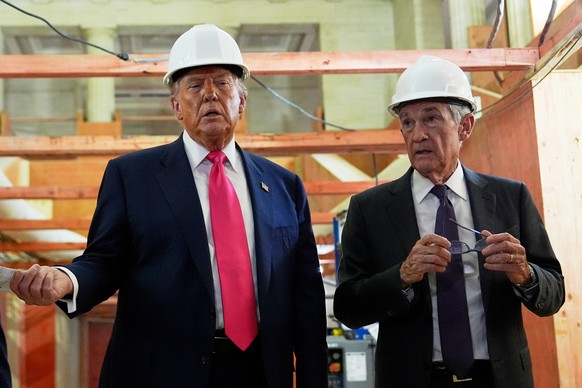 FILE - President Donald Trump speaks with Federal Reserve Chairman Jerome Powell during a visit to the Federal Reserve, Thursday, July 24, 2025, in Washington. (AP Photo/Julia Demaree Nikhinson, File) ...