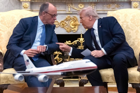 President Donald Trump, right, talks with German Chancellor Friedrich Merz during a meeting in the Oval Office at the White House, Tuesday, March 3, 2026, in Washington. (AP Photo/Mark Schiefelbein)
D ...