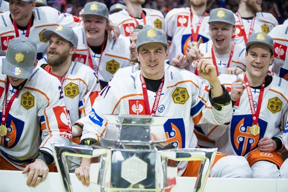 Tappara&#039;s capatain Kristian Kuusela, centre, celebrates with the rest of the team after winning the Champions Hockey League final ice hockey match between Lulea Hockey and Tappara Tampere at Coop ...