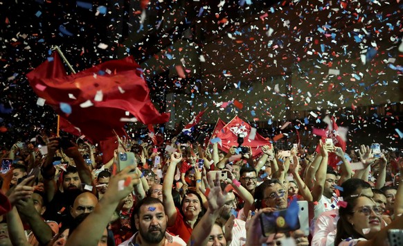 epaselect epa10601270 Supporters of President-elect of the Colorado Party Santiago Pena celebrate after his victory outside his campaign headquarters in Asuncion, Paraguay, 30 April 2023. Pena was pro ...