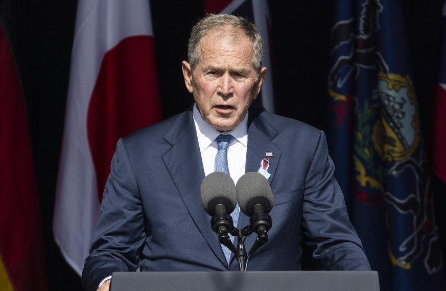 epa09461386 On the 20th anniversary of 9/11, former US President George W Bush speaks at the Flight 93 National Memorial in Shanksville, Pennsylvania, USA, 11 September 2021. Forty passengers and crew ...