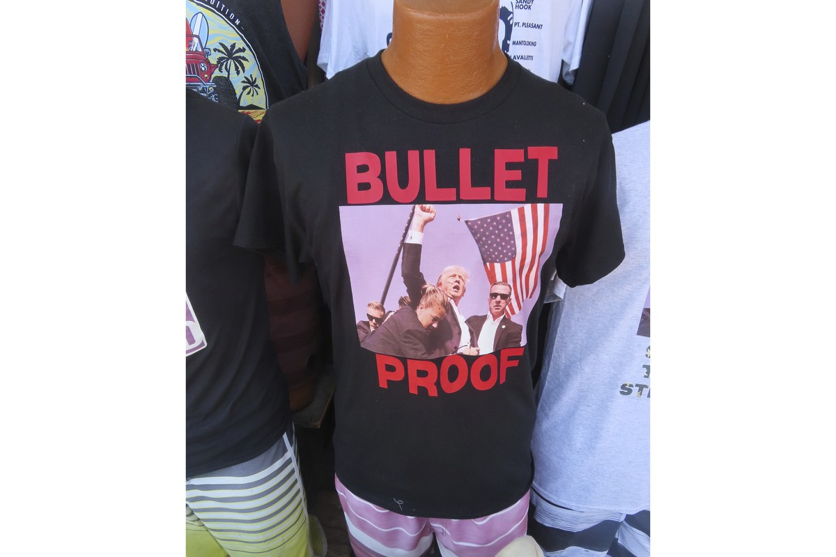 T-shirts referencing the shooting of former President Donald Trump were selling briskly on the boardwalk in Wildwood, N.J. on July 15, 2024, less than 48 hours after the incident.(AP Photo/Wayne Parry ...