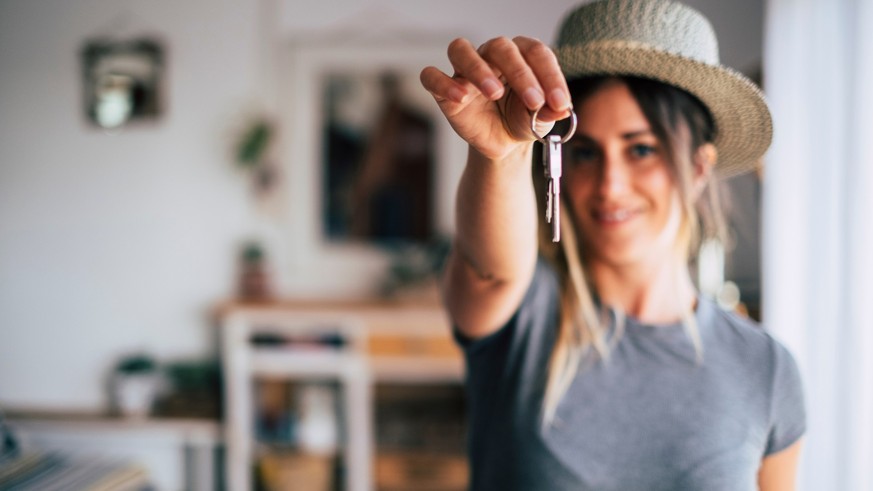 Crop close up of female tenant renter show praise house keys moving to first own new apartment or house, happy woman owner buy purchase home, relocate to dwelling, rental, rent, ownership concept