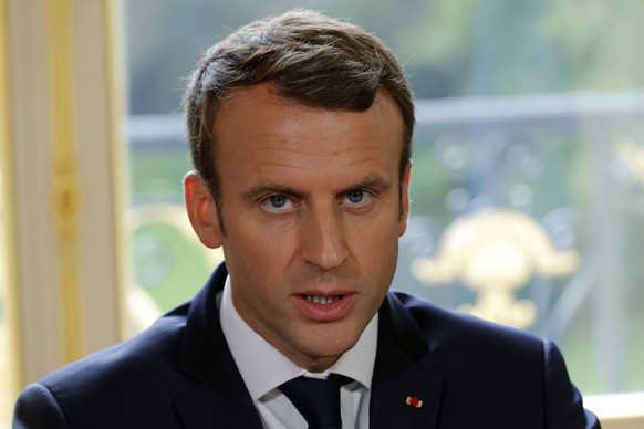 epa06219748 French President Emmanuel Macron delivers a speech after signing documents in front of the media to promulgate a new labour bill in his office at the Elysee Palace in Paris, France, 22 Sep ...