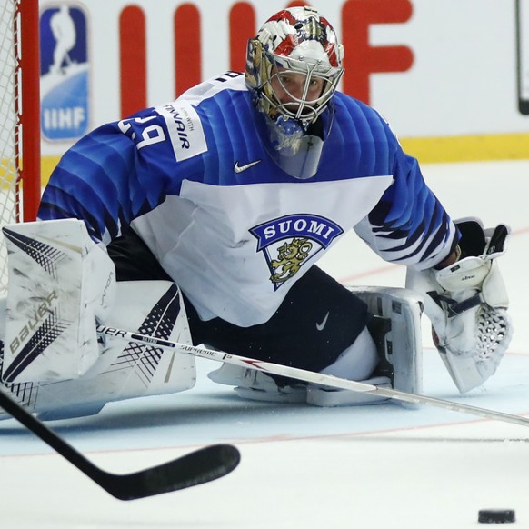 Finland&#039;s Miro Heiskanen, center, and Finland&#039;s goalkeeper Harri Sateri, left, try to stop Canada&#039;s Ryan Nugent-Hopkins, right, during the Ice Hockey World Championships group B match b ...