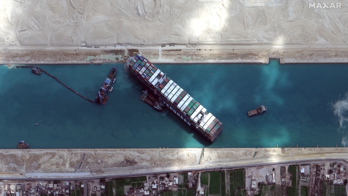 This satellite image from Maxar Technologies shows the cargo ship MV Ever Given stuck in the Suez Canal near Suez, Egypt, Sunday, March 28, 2021. Two additional tugboats sped Sunday to Egypt's Su ...