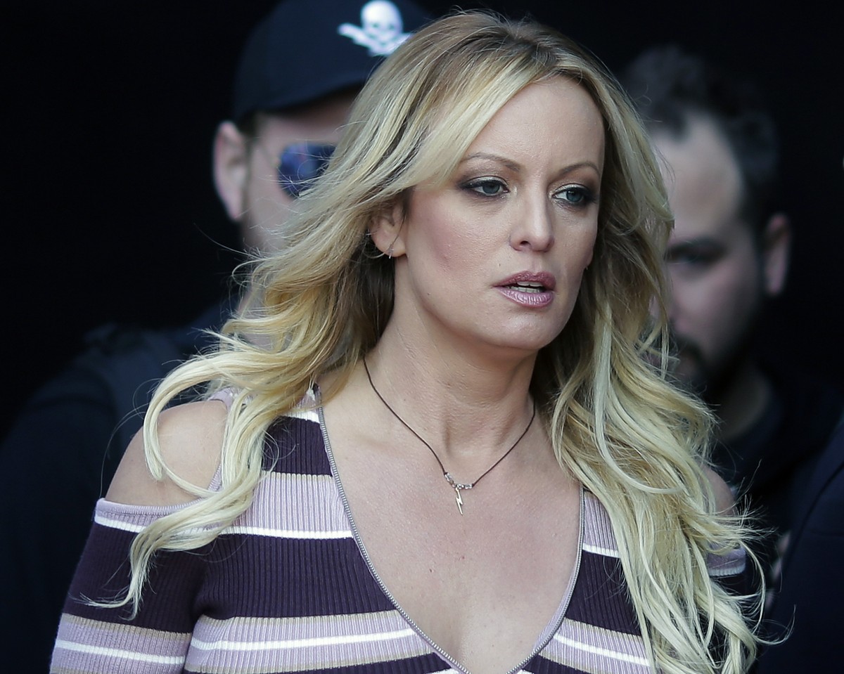 FILE - In this Oct. 11, 2018, file photo, adult film actress Stormy Daniels arrives at the adult entertainment fair "Venus" in Berlin. A federal judge has thrown out a lawsuit against Presid ...