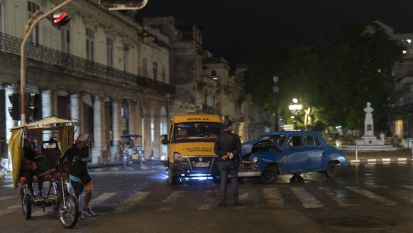 A police officer guards the site of a crash in Havana, Monday, Jan. 20, 2025, the day U.S. President Donald Trump was inaugurated. (AP Photo/Ramon Espinosa)
