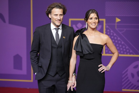 Former soccer player Diego Forlan and his wife Paz Cardoso arrive for the 2022 soccer World Cup draw at the Doha Exhibition and Convention Center in Doha, Qatar, Friday, April 1, 2022. (AP Photo/Darko ...