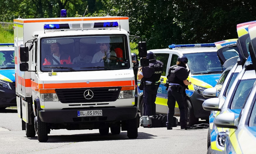 epa11477440 Police officers and emergency services gather at a street in Albstadt-Lautlingen, Germany, 14 July 2024. Police have found three dead and two injured in a large-scale operation after an in ...