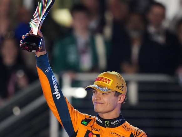 Second place finisher McLaren driver Lando Norris of Great Britain celebrates with his trophy after the Formula One Las Vegas Grand Prix auto race, Saturday, Nov. 22, 2025 in Las Vegas. (AP Photo/Nick ...