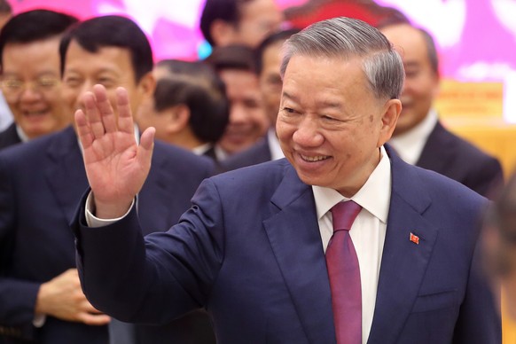 epa11520960 Newly elected General Secretary To Lam waves as he leaves after a press conference after The Communist Party of Vietnam (CPV) elected President To Lam as General Secretary of the CPV Centr ...