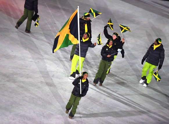 epa06508243 Team Jamaica with flag bearer Audra Segree arrives during the Opening Ceremony of the PyeongChang 2018 Olympic Games at the Olympic Stadium, Pyeongchang county, South Korea, 09 February 20 ...