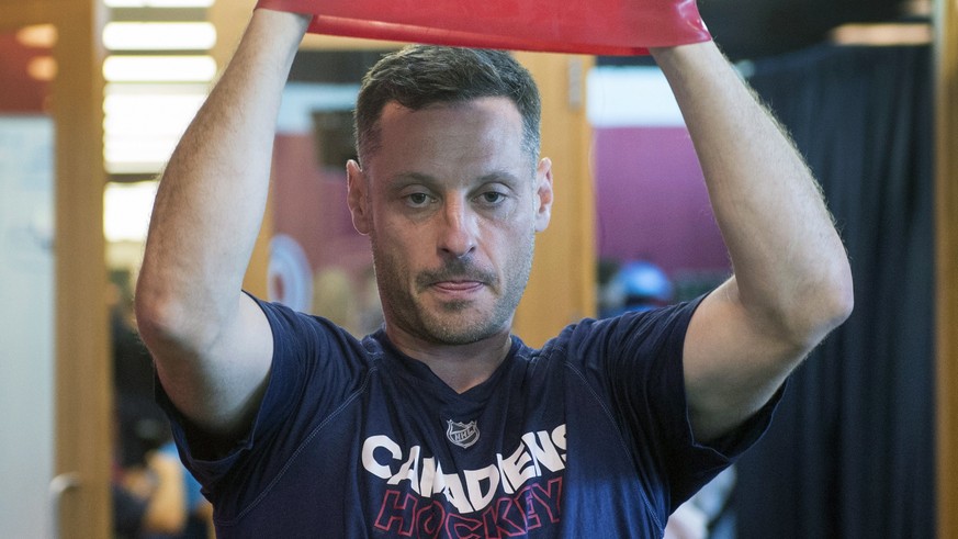 Montreal Canadiens defenseman Mark Streit, from Switzerland, stretches during medical exams on the first day of training camp Thursday in Brossard, Quebec, Thursday, Sept. 14, 2017. (Ryan Remiorz/The  ...