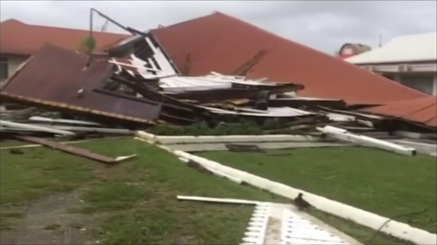 This image made from a video, shows parliament house damaged by Cyclone Gita in Nuku’alofa, Tonga Tuesday, Feb. 13, 2018. Tonga began cleaning up Tuesday after a cyclone hit overnight, while some peop ...