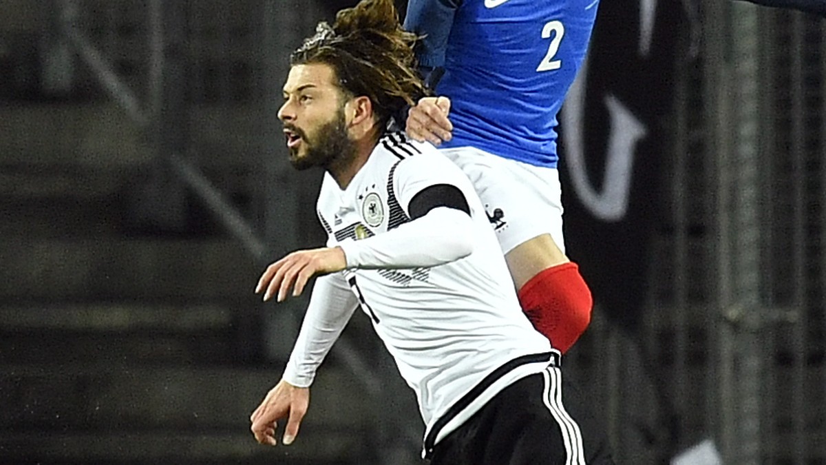 Germany's Marvin Plattenhardt, left, and France's Christophe Jallet, right, go for a header during an international friendly soccer match between Germany and France in Cologne, Germany, Tues ...
