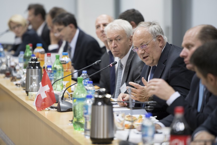 Swiss Federal Councillor Johann Schneider-Ammann, third from right, speaks during a meeting with Abeer Odeh, Minister of National Economy (not pictured) at the Palestinian Ministry of National Economy ...