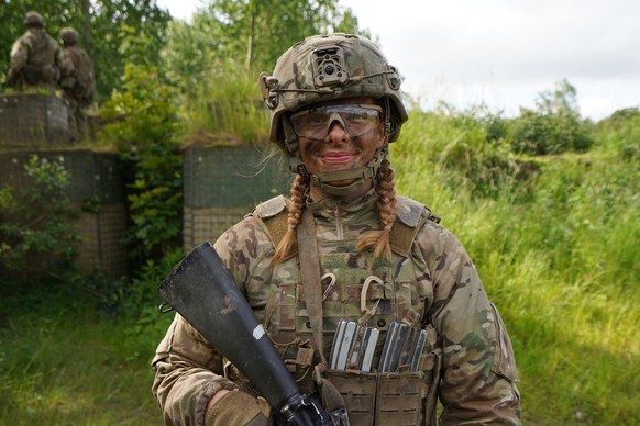 CORRECTS THE NAME OF PERSON&#039;S ROLE 20-year-old Katrine poses for a photo during final exercises at a training area close to Royal Danish Army?s barracks in Hovelte, 25 kilometres north of Copenha ...